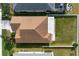 Aerial view of home showing backyard, fence and brown shingle roof at 7750 Ridgelake Cir, Bradenton, FL 34203