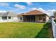 Well-maintained backyard with a screened patio and fenced perimeter at 7750 Ridgelake Cir, Bradenton, FL 34203