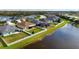 A home's fenced backyard adjoins a peaceful pond for serene views at 7750 Ridgelake Cir, Bradenton, FL 34203