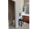 Bathroom with a vanity, toilet, stool and a large mirror at 7750 Ridgelake Cir, Bradenton, FL 34203