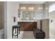 Bathroom with a double vanity, large mirror, glass shower and a ceiling fan at 7750 Ridgelake Cir, Bradenton, FL 34203
