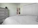 Bedroom with a closet, doorway, and a dresser at 7750 Ridgelake Cir, Bradenton, FL 34203