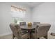 A bright breakfast nook with seating for four, a quaint window, and warm, inviting decor at 7750 Ridgelake Cir, Bradenton, FL 34203