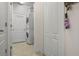 Clean laundry room with stacked washer and dryer and ample storage space at 7750 Ridgelake Cir, Bradenton, FL 34203