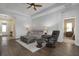 Open concept living area with neutral tones and elegant lighting features a comfortable seating arrangement at 7750 Ridgelake Cir, Bradenton, FL 34203