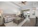 The living area boasts a ceiling fan, wood floors, and sliding doors for easy access to the outdoors at 7750 Ridgelake Cir, Bradenton, FL 34203