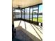 Relaxing screened patio with ample natural light and serene backyard views at 7750 Ridgelake Cir, Bradenton, FL 34203