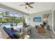 Relaxing screened lanai with comfortable wicker furniture overlooking a sparkling pool at 7983 Sandstar Way, Sarasota, FL 34240