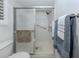 Bright bathroom featuring glass enclosed shower, and linen closet at 821 Montrose Dr # 103, Venice, FL 34293
