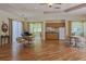 Bright common area featuring ample seating, piano, and a kitchenette with appliances at 821 Montrose Dr # 103, Venice, FL 34293