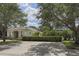Charming home featuring mature trees, a landscaped yard, and a private driveway at 821 Montrose Dr # 103, Venice, FL 34293
