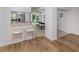 Contemporary kitchen with breakfast bar overlooking a dining area and sliding glass doors at 821 Montrose Dr # 103, Venice, FL 34293
