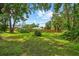 Fenced backyard featuring lush landscaping providing seclusion and privacy at 8240 Cypress Lake Dr, Sarasota, FL 34243