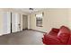 Spacious bedroom with pool view, ceiling fan, and ample closet space at 8240 Cypress Lake Dr, Sarasota, FL 34243