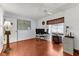 Spacious home office featuring hardwood floors, a window, and file cabinets at 8240 Cypress Lake Dr, Sarasota, FL 34243