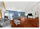 Open-concept living room with hardwood floors and ample space for entertaining and relaxation at 8240 Cypress Lake Dr, Sarasota, FL 34243