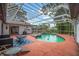 Enclosed pool area with outdoor seating and a spa at 8240 Cypress Lake Dr, Sarasota, FL 34243