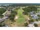 Expansive aerial view of the community, showcasing the golf course, ponds, and neatly arranged homes at 9236 Raes Creek Pl, Palmetto, FL 34221