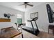 Bedroom featuring a ceiling fan and a wall-mounted TV, perfect for home workouts at 9236 Raes Creek Pl, Palmetto, FL 34221