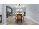 Comfortable dining room features wood floors, a large window and stylish furniture at 9236 Raes Creek Pl, Palmetto, FL 34221
