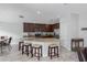 Beautiful kitchen has an island with seating, pendant lighting, granite counters, and stainless appliances at 9236 Raes Creek Pl, Palmetto, FL 34221