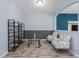 Sitting room with two chairs, a glass table, and built in shelves. Ready to be enjoyed! at 9236 Raes Creek Pl, Palmetto, FL 34221
