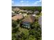 A beautiful screened-in pool and backyard with manicured landscaping, surrounded by a vibrant neighborhood at 12261 Stuart Dr, Venice, FL 34293