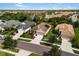 Beautiful aerial view of single-story homes in a lush community with lake views and meticulously maintained lawns at 12261 Stuart Dr, Venice, FL 34293
