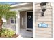 Charming front porch with a decorative wreath and 