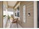 Cozy front porch seating area with two chairs and a 