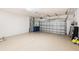 Spacious two car garage with epoxy floor, overhead storage rack and ample storage space at 12261 Stuart Dr, Venice, FL 34293