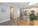 Bright kitchen with white cabinets, stainless appliances, a central island, and an adjacent dining area at 12261 Stuart Dr, Venice, FL 34293