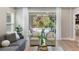 Bright living room featuring modern decor and sliding glass doors with a pool view at 12261 Stuart Dr, Venice, FL 34293