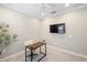 Home office space featuring a desk and mounted TV at 12261 Stuart Dr, Venice, FL 34293