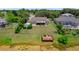 Expansive backyard featuring a wooden deck, storage shed, and screened-in pool area, ideal for outdoor living at 1299 Tripoli, North Port, FL 34286