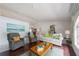Bright living room featuring wood floors, neutral walls, and comfortable seating at 1299 Tripoli, North Port, FL 34286