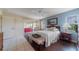 Light-filled main bedroom features a ceiling fan and access to the lanai at 1299 Tripoli, North Port, FL 34286