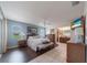 Spacious main bedroom with a ceiling fan, and outdoor access, seamlessly blending comfort with indoor and outdoor living at 1299 Tripoli, North Port, FL 34286