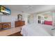 Bright main bedroom featuring a ceiling fan, and access to the lanai and en-suite at 1299 Tripoli, North Port, FL 34286