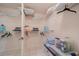 Well-organized walk-in closet with multiple shelves and hanging space for efficient storage at 1299 Tripoli, North Port, FL 34286