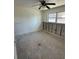 An unfinished bedroom featuring a ceiling fan and a bright window at 13434 1St St E, Madeira Beach, FL 33708