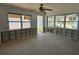 A large living room awaits renovation and finishing with bright, natural light at 13434 1St St E, Madeira Beach, FL 33708