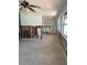 A large living room awaits renovation showing interior framing and bright, natural light at 13434 1St St E, Madeira Beach, FL 33708