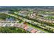 Picturesque aerial view showcasing the home's location near beautiful lakes, a golf course, and other community amenities at 13513 Deep Blue Pl, Bradenton, FL 34211