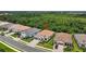 Beautiful aerial view of the property with a lush, wooded backdrop offering privacy and natural beauty at 13513 Deep Blue Pl, Bradenton, FL 34211