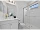 Bright bathroom with white subway tile shower and modern vanity at 13513 Deep Blue Pl, Bradenton, FL 34211