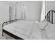 Serene bedroom with tile floors, neutral color palette, and natural light at 13513 Deep Blue Pl, Bradenton, FL 34211
