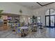 Elegant clubhouse with bar seating, tables, and large arched windows that let in natural light, with easy access to pool at 13513 Deep Blue Pl, Bradenton, FL 34211