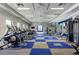 Community gym with state-of-the-art equipment, light colored walls, large windows, and checkerboard floor at 13513 Deep Blue Pl, Bradenton, FL 34211