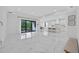 Spacious living room featuring marble floors, modern decor and a walk out patio at 13513 Deep Blue Pl, Bradenton, FL 34211